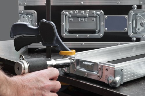 Man using rivet gun