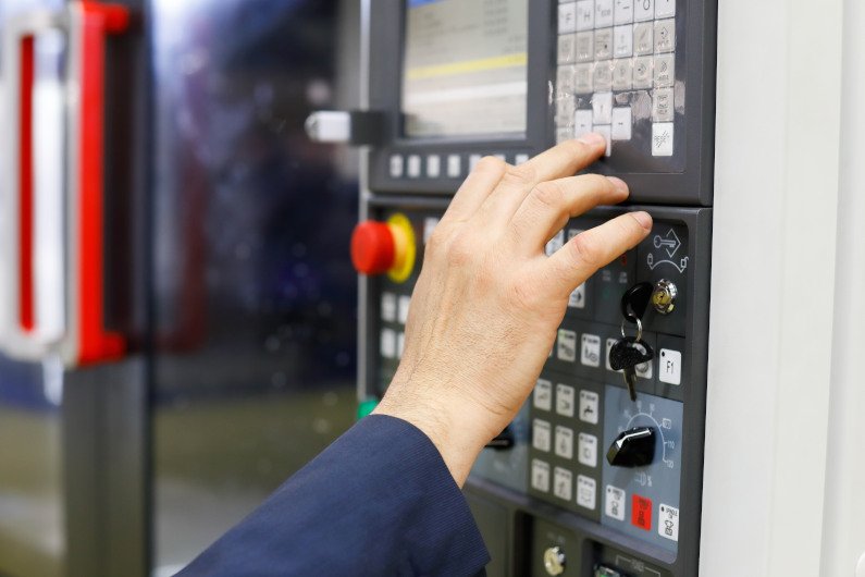 Operator working cnc machining center