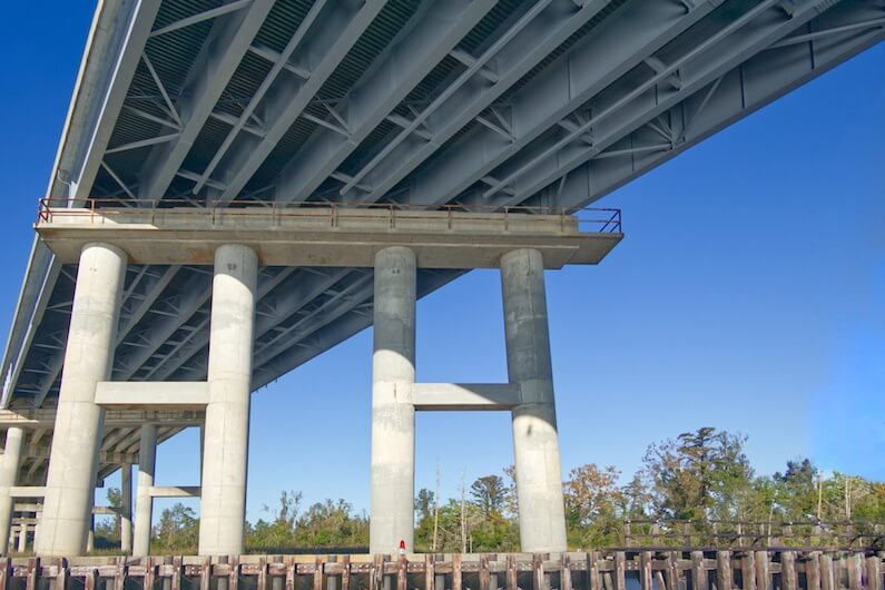 Concrete support piles below bridge