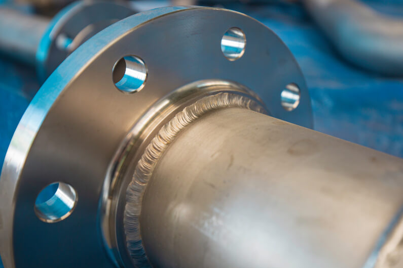Steel piping flange welded onto pipe