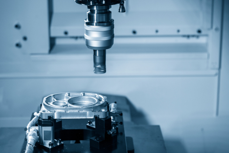 CNC milling machine rough cutting the aluminum die casting parts (machined casting)
