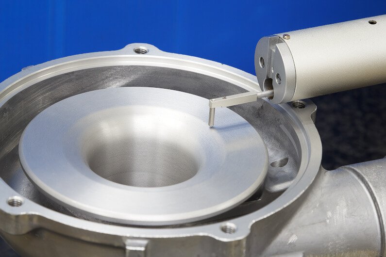 Surface roughness meter checking machined casting