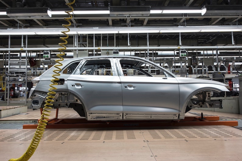 Gray vehicle frame inside factory