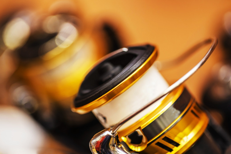 Spinning coil coated with titanium nitride for fishing