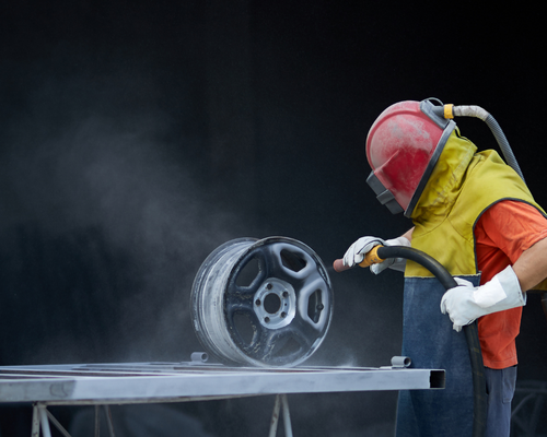 a person uses specialist equipment to remove chrome plating from metal